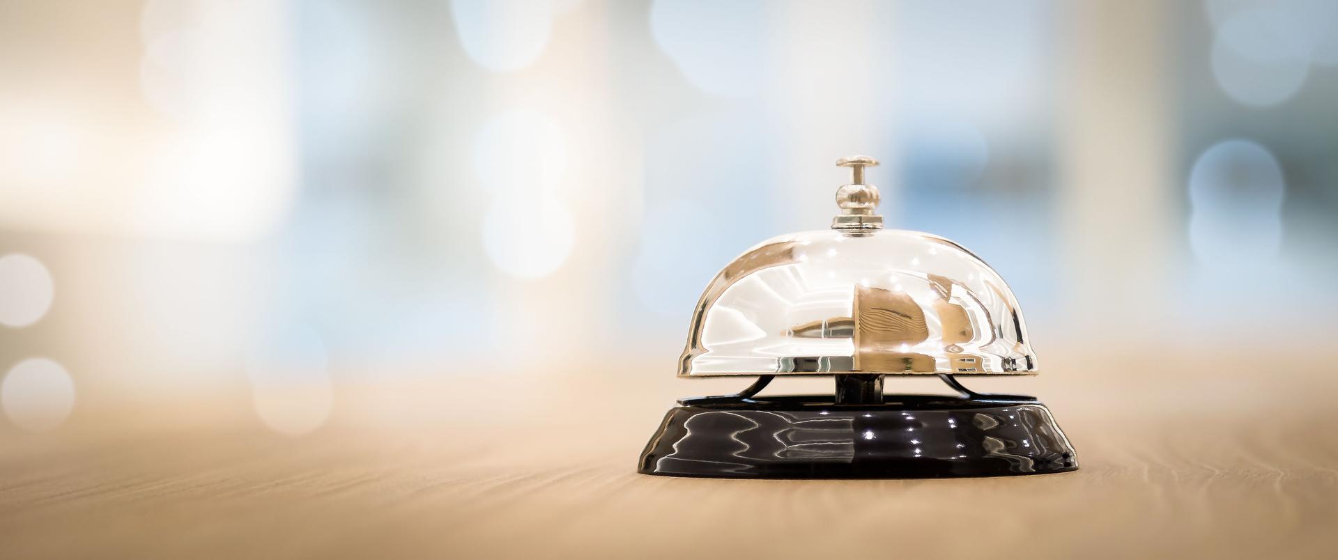 Metal service bells on wooden floor Service concept and customer assistance.
