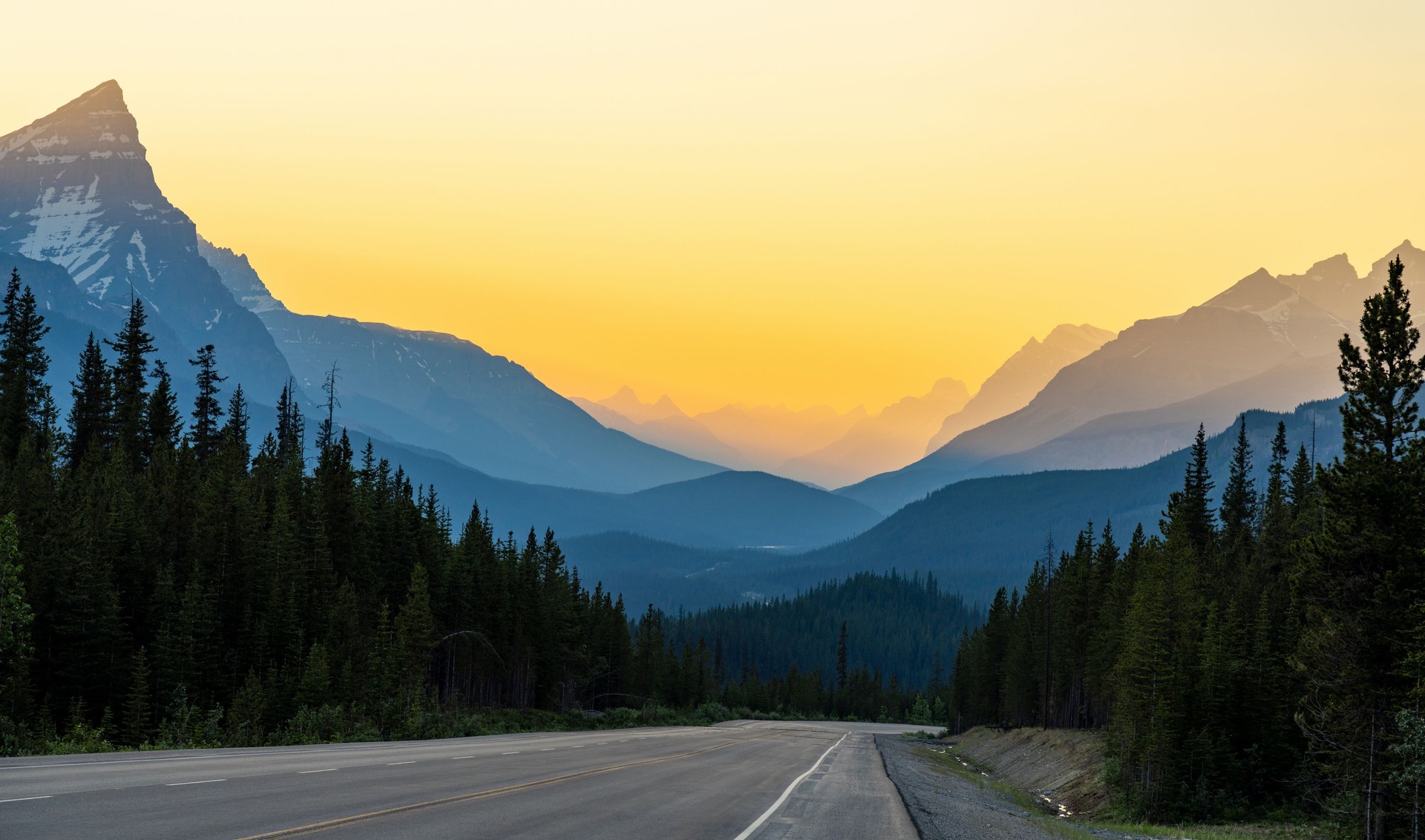 Driving on Icefields Parkway at twilight time. Jasper National Park, Canada.